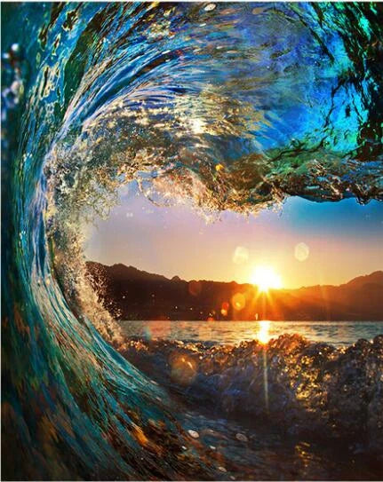 Ocean wave with sunset in background through the wave